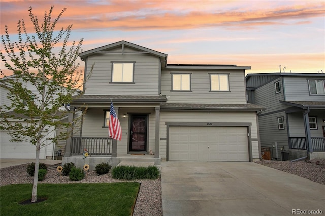 1607 Goldfield Trl, Castle Rock, CO 80109 - view of front of house featuring covered porch, concrete driveway, a garage, and a shingled roof