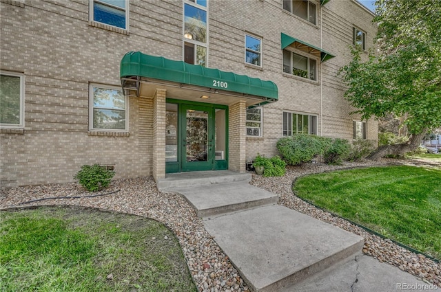 2100 N Franklin St Unit 15, Denver, CO 80205 - view of exterior entry featuring brick siding