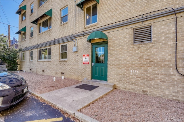 2100 N Franklin St Unit 15, Denver, CO 80205 - view of exterior entry with brick siding and crawl space