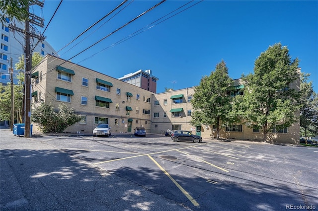 2100 N Franklin St Unit 15, Denver, CO 80205 - view of apartment building / complex featuring uncovered parking