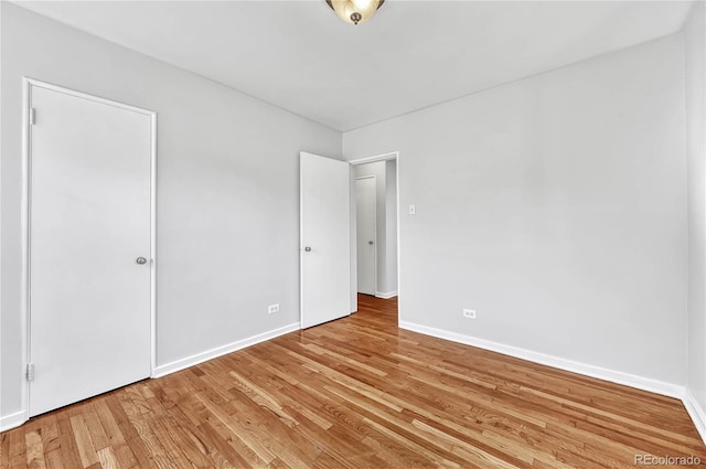 2100 N Franklin St Unit 15, Denver, CO 80205 - unfurnished bedroom with light wood-style flooring and baseboards