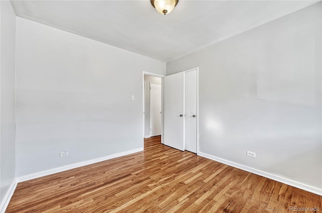 2100 N Franklin St Unit 15, Denver, CO 80205 - empty room with baseboards and wood finished floors