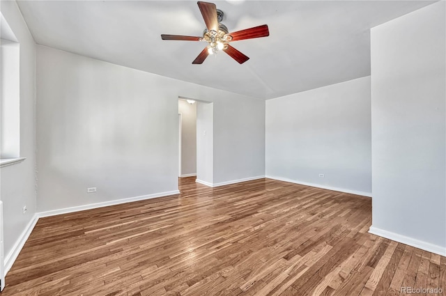 2100 N Franklin St Unit 15, Denver, CO 80205 - spare room featuring a ceiling fan, wood finished floors, and baseboards