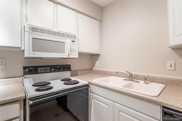 kitchen with white cabinets, white appliances, and sink