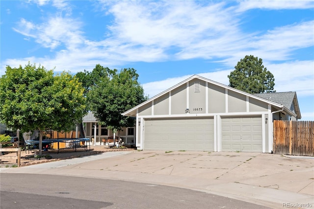 16673 E Kent Dr, Aurora, CO 80013 - view of front of home with driveway and an attached garage