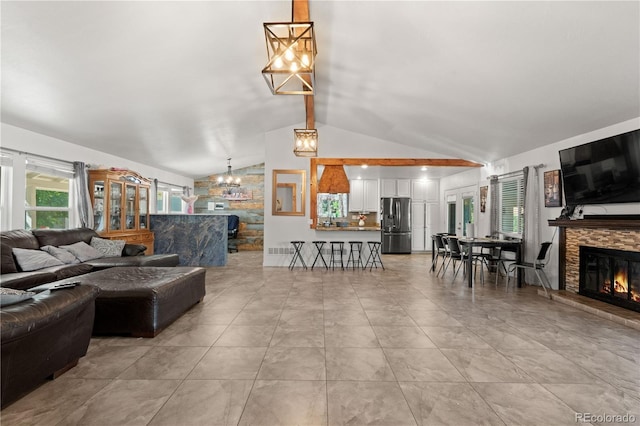 16673 E Kent Dr, Aurora, CO 80013 - living area featuring a chandelier and a fireplace