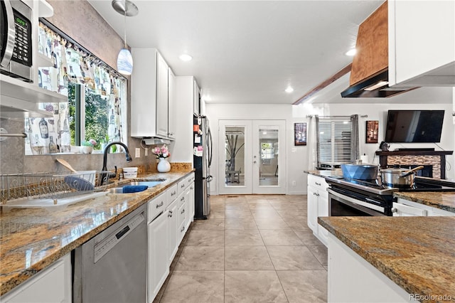 16673 E Kent Dr, Aurora, CO 80013 - kitchen featuring stainless steel appliances, white cabinets, tasteful backsplash, stone counters, and recessed lighting