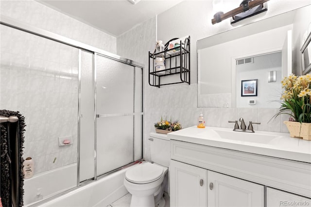 16673 E Kent Dr, Aurora, CO 80013 - bathroom with vanity and combined bath / shower with glass door