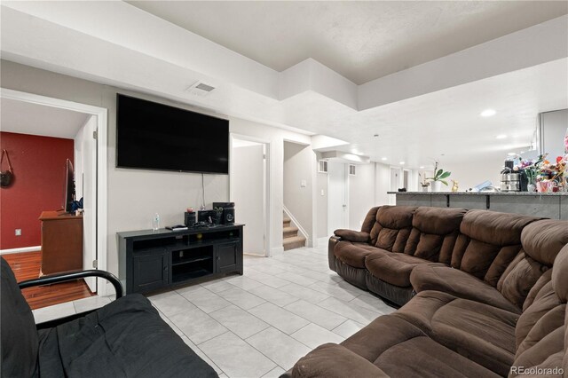 16673 E Kent Dr, Aurora, CO 80013 - living room featuring stairway and baseboards