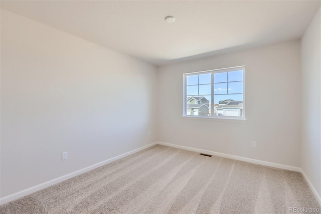 spare room featuring carpet floors