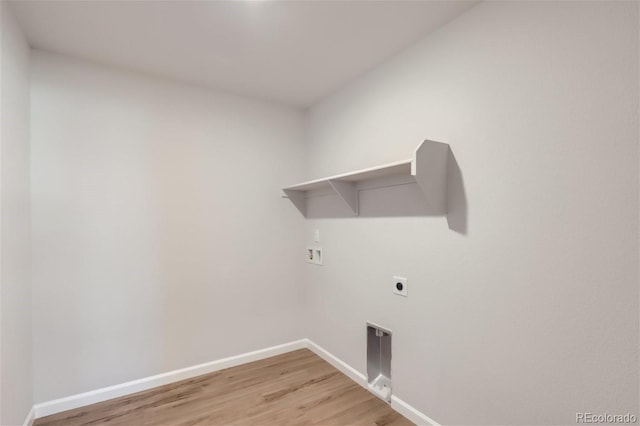 laundry room featuring washer hookup, light wood-type flooring, and hookup for an electric dryer