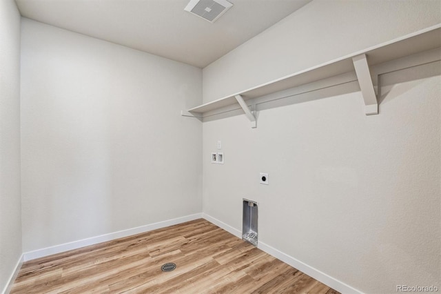 washroom with laundry area, washer hookup, baseboards, light wood finished floors, and electric dryer hookup