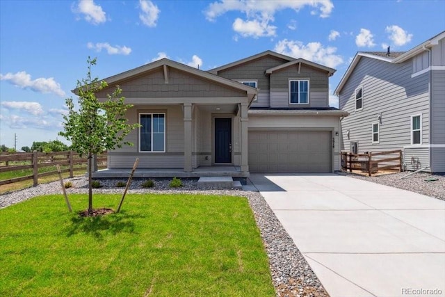 5918 Red Barn Ave, Mead, CO 80504 - craftsman-style house with covered porch, concrete driveway, and an attached garage