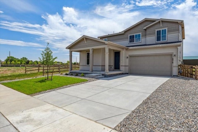 5918 Red Barn Ave, Mead, CO 80504 - view of front facade featuring covered porch, driveway, and an attached garage