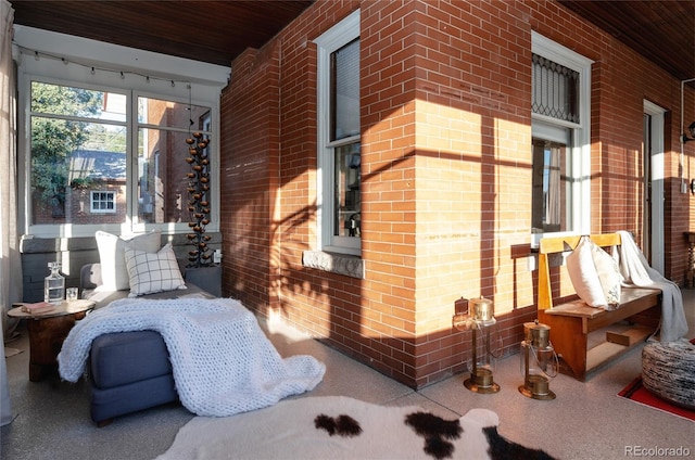 2096 S Logan St, Denver, CO 80210 - view of property exterior featuring a porch and brick siding