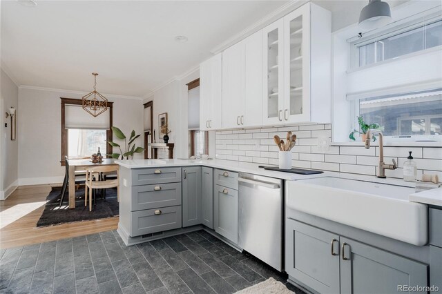 2096 S Logan St, Denver, CO 80210 - kitchen featuring dishwasher, gray cabinetry, light countertops, a peninsula, and glass insert cabinets