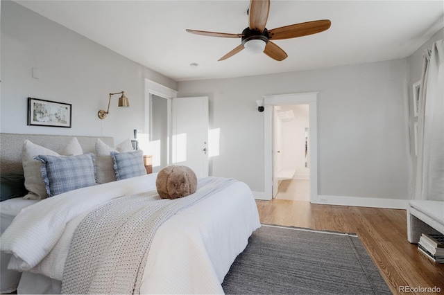 2096 S Logan St, Denver, CO 80210 - bedroom featuring wood finished floors, ceiling fan, and ensuite bathroom