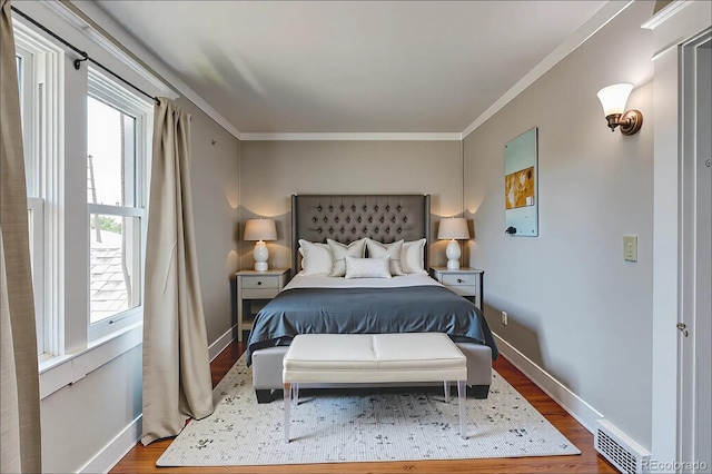 2096 S Logan St, Denver, CO 80210 - bedroom with multiple windows, wood finished floors, and crown molding
