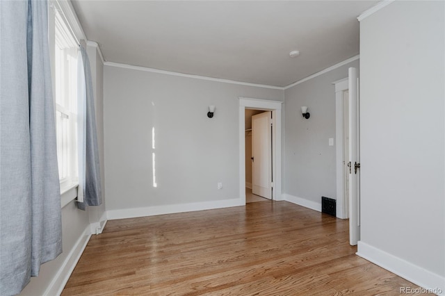 2096 S Logan St, Denver, CO 80210 - empty room featuring light wood-style floors and crown molding