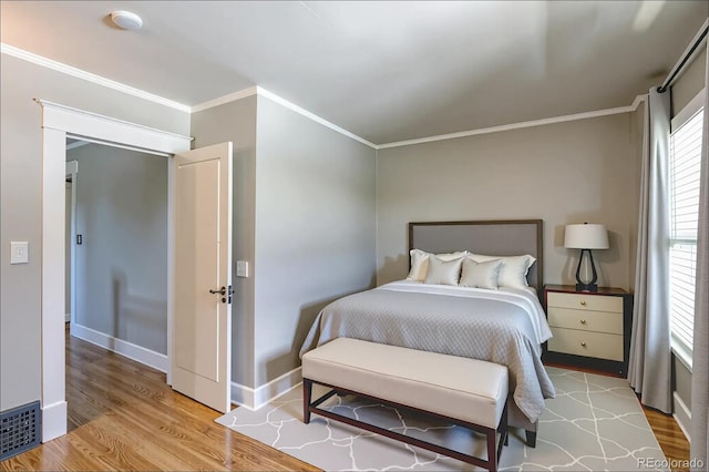 2096 S Logan St, Denver, CO 80210 - bedroom with ornamental molding and wood finished floors