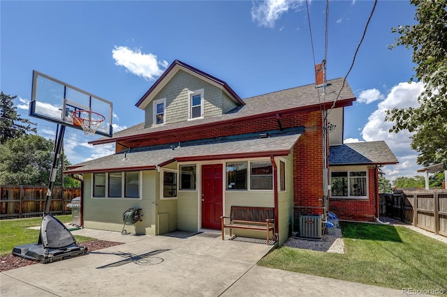 2096 S Logan St, Denver, CO 80210 - back of house with a shingled roof, a fenced backyard, a patio area, a chimney, and brick siding