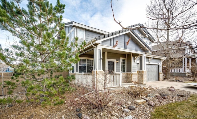 craftsman-style house featuring a porch and a garage