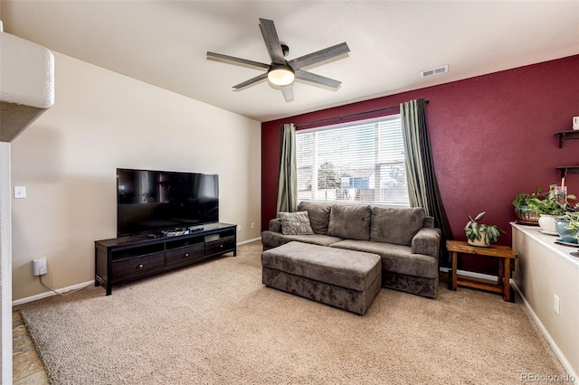 carpeted living room featuring ceiling fan