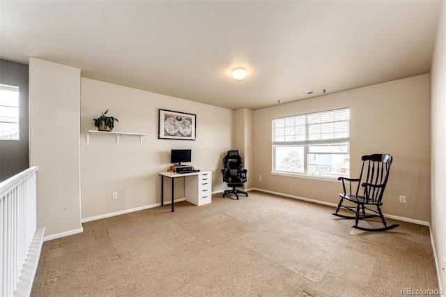 sitting room featuring light carpet