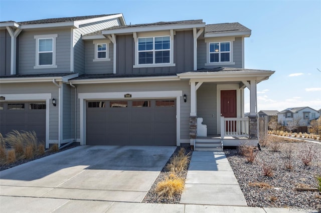 view of front of home with board and batten siding, concrete driveway, and an attached garage