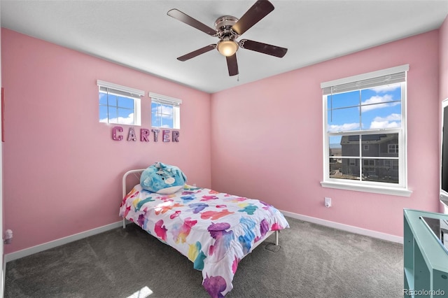 bedroom with baseboards, carpet floors, and ceiling fan