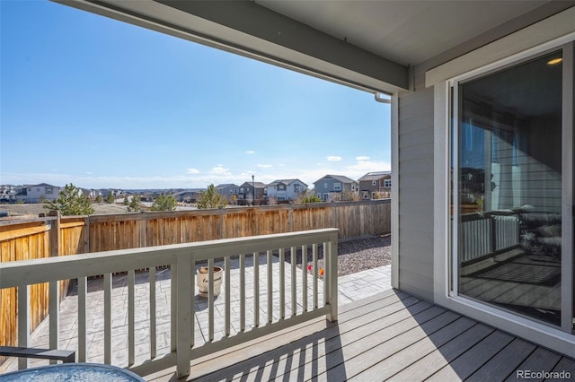 deck with a fenced backyard and a residential view