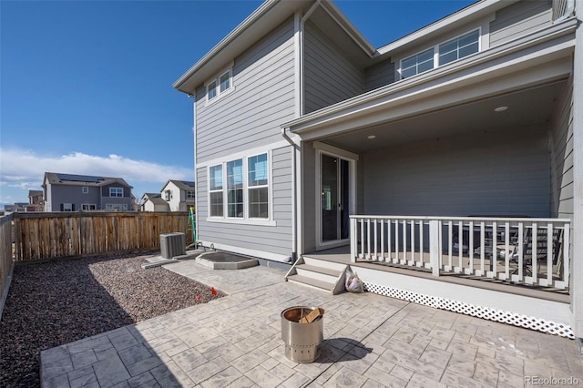 view of patio / terrace featuring cooling unit and fence