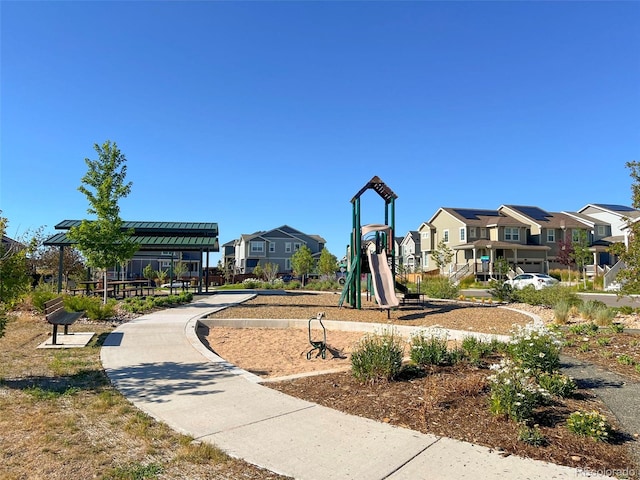 view of community featuring playground community and a residential view