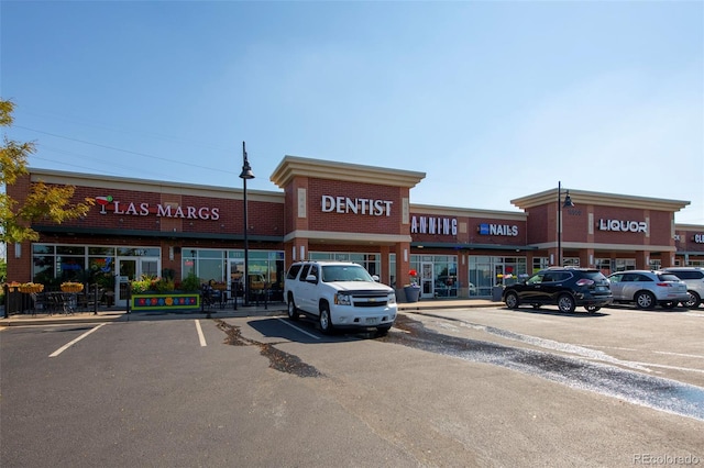 view of property featuring uncovered parking