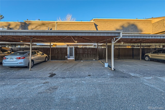 view of vehicle parking with a carport