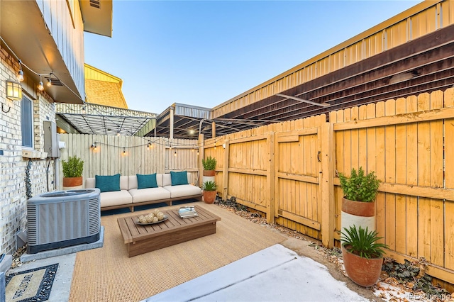 view of patio with an outdoor hangout area and central AC