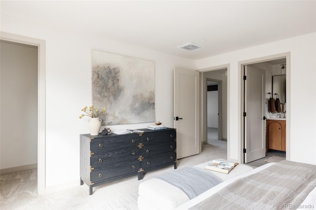 bedroom featuring baseboards, visible vents, and light colored carpet