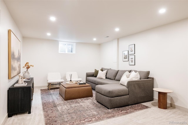 living area with baseboards, light colored carpet, and recessed lighting