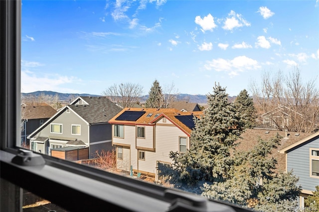 balcony with a mountain view and a residential view