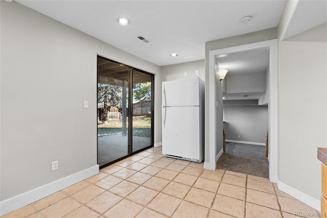 unfurnished room with recessed lighting, visible vents, and baseboards