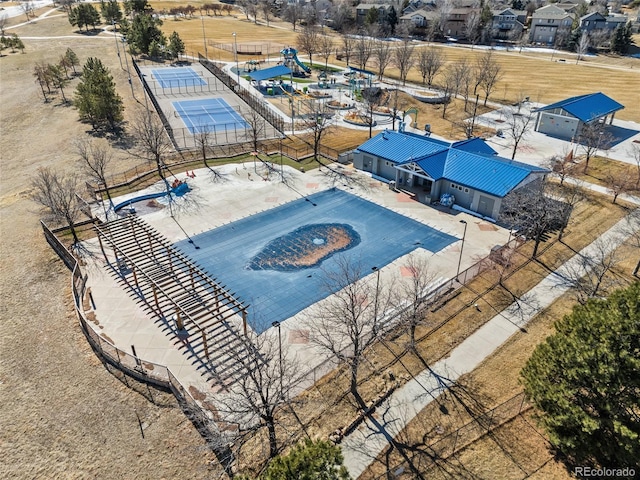 view of swimming pool with fence