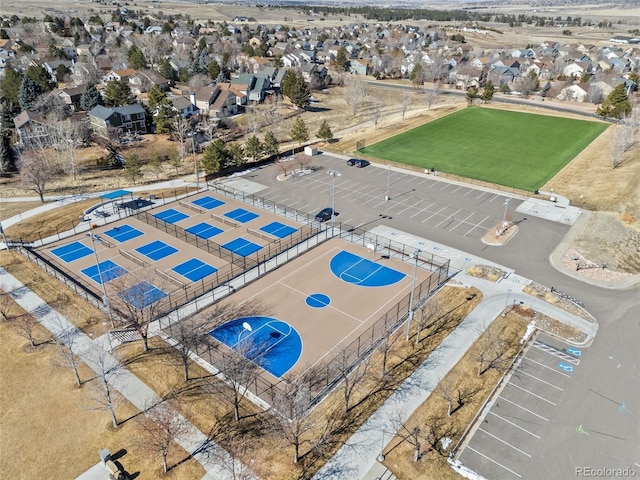 birds eye view of property with a residential view