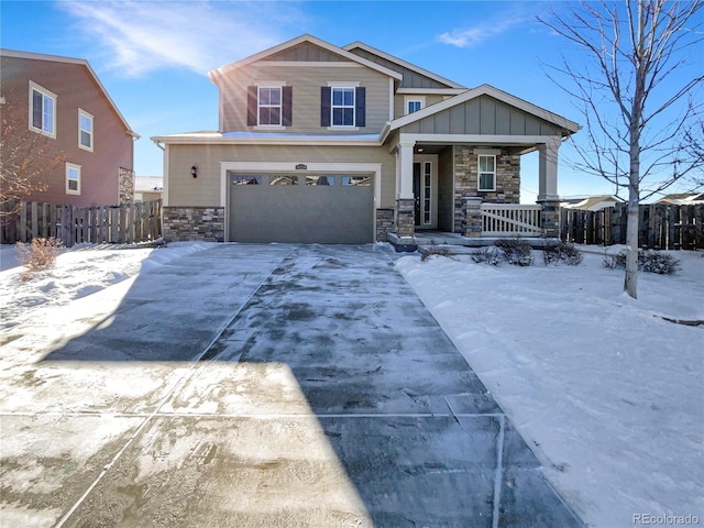 view of front of home featuring a garage and a porch