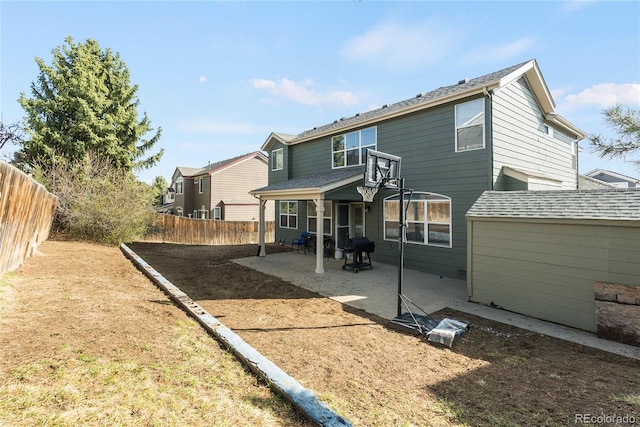 5149 S Genoa Ct, Centennial, CO 80015 - rear view of house featuring a patio and a fenced backyard
