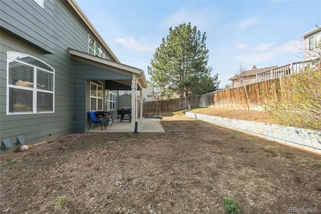 5149 S Genoa Ct, Centennial, CO 80015 - fenced backyard featuring a patio area
