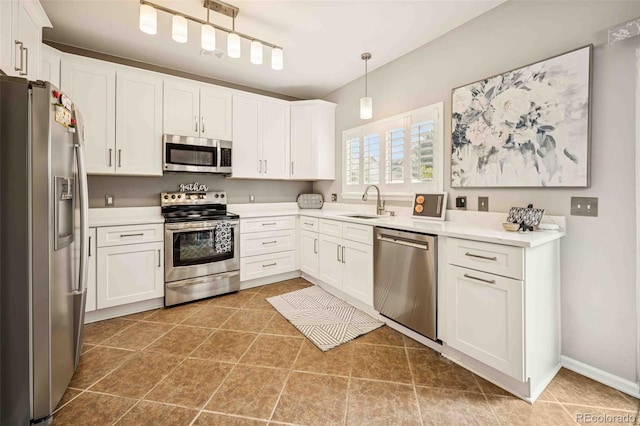 2476 S Gibralter Way, Aurora, CO 80013 - kitchen with stainless steel appliances, white cabinets, light countertops, and hanging light fixtures
