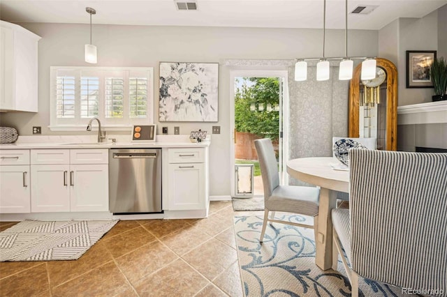 2476 S Gibralter Way, Aurora, CO 80013 - kitchen featuring stainless steel dishwasher, light countertops, and plenty of natural light