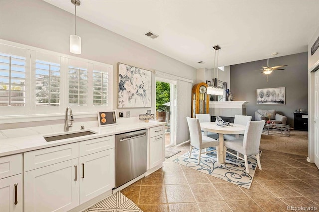2476 S Gibralter Way, Aurora, CO 80013 - kitchen featuring stainless steel dishwasher, pendant lighting, white cabinets, and light tile patterned floors