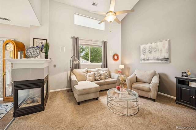 2476 S Gibralter Way, Aurora, CO 80013 - living area featuring a high ceiling, ceiling fan, light carpet, and a multi sided fireplace