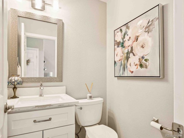 2476 S Gibralter Way, Aurora, CO 80013 - bathroom featuring vanity and a textured wall